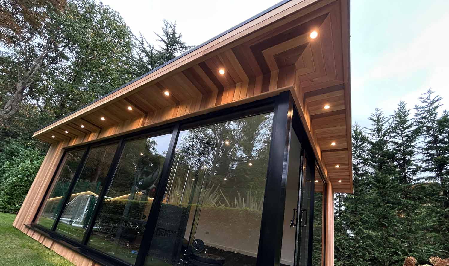 LED canopy lighting on a garden room at night