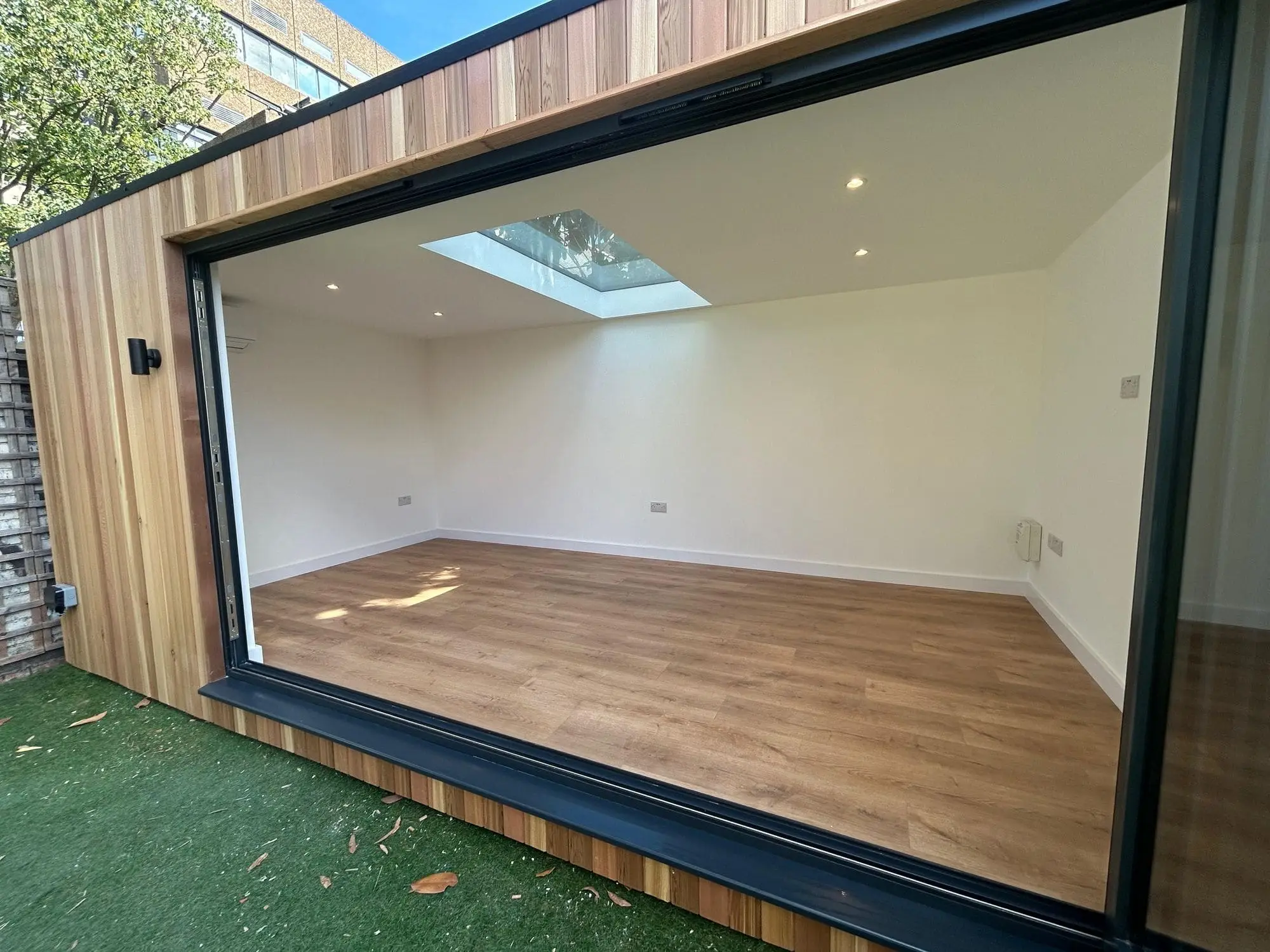 Garden pod with 3.6m bifold doors open