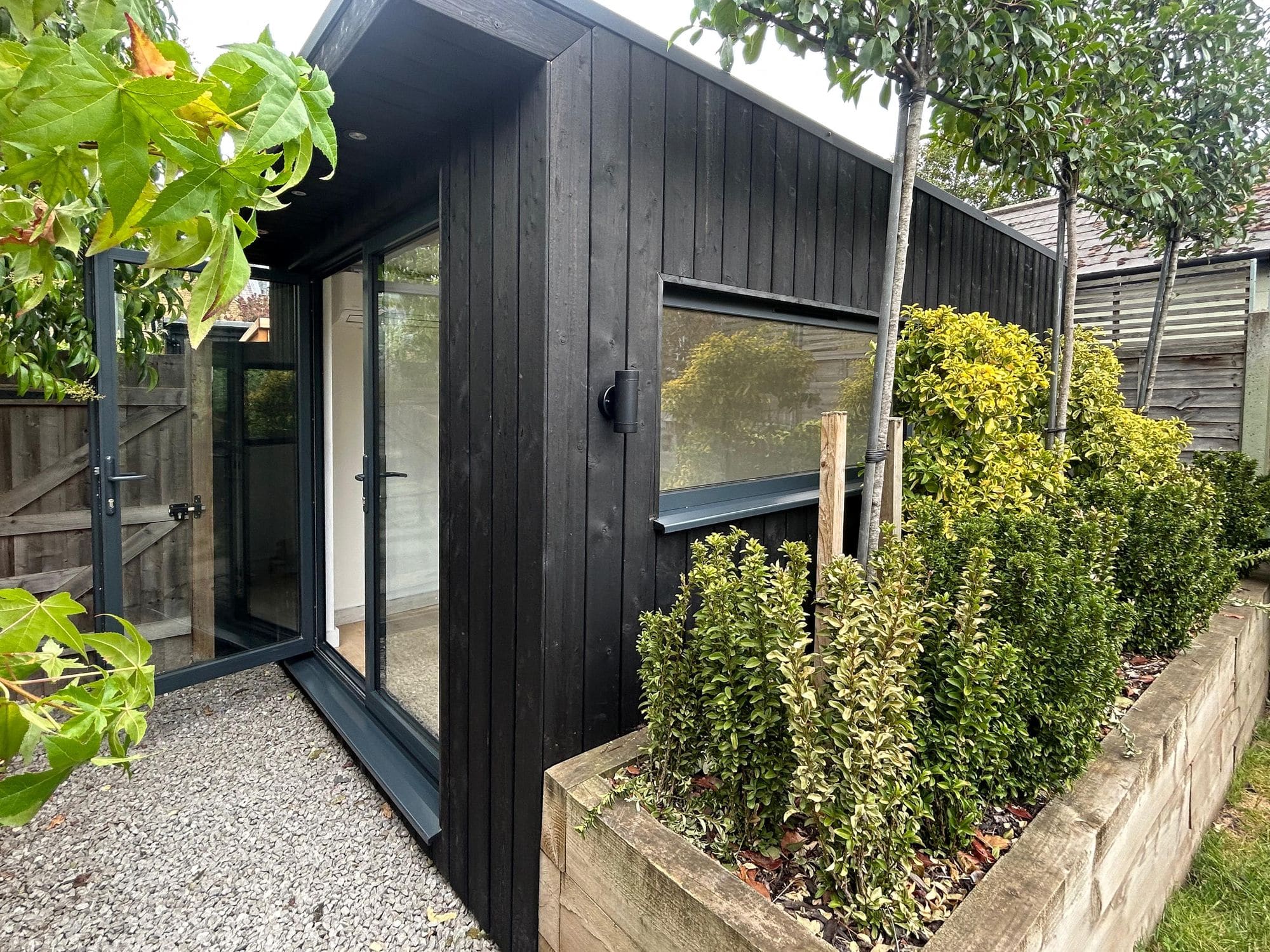 Garden room with charred spruce cladding, Surrey