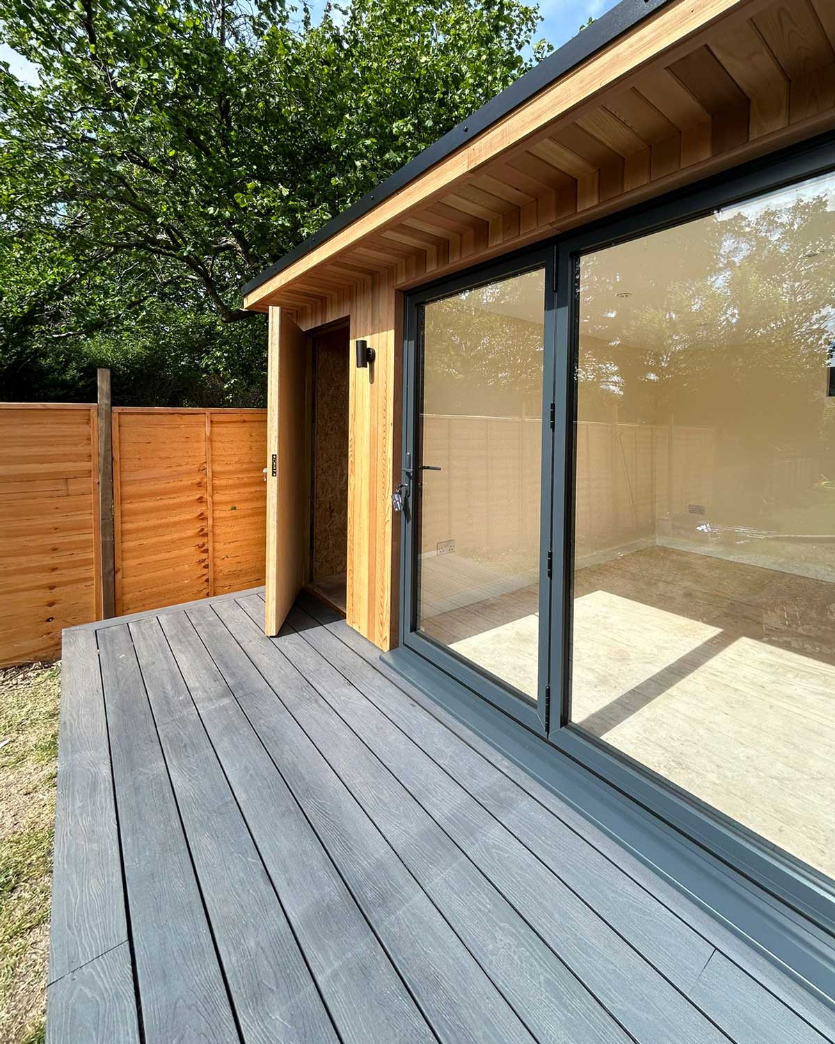 Garden room with composite decking in a Surrey garden
