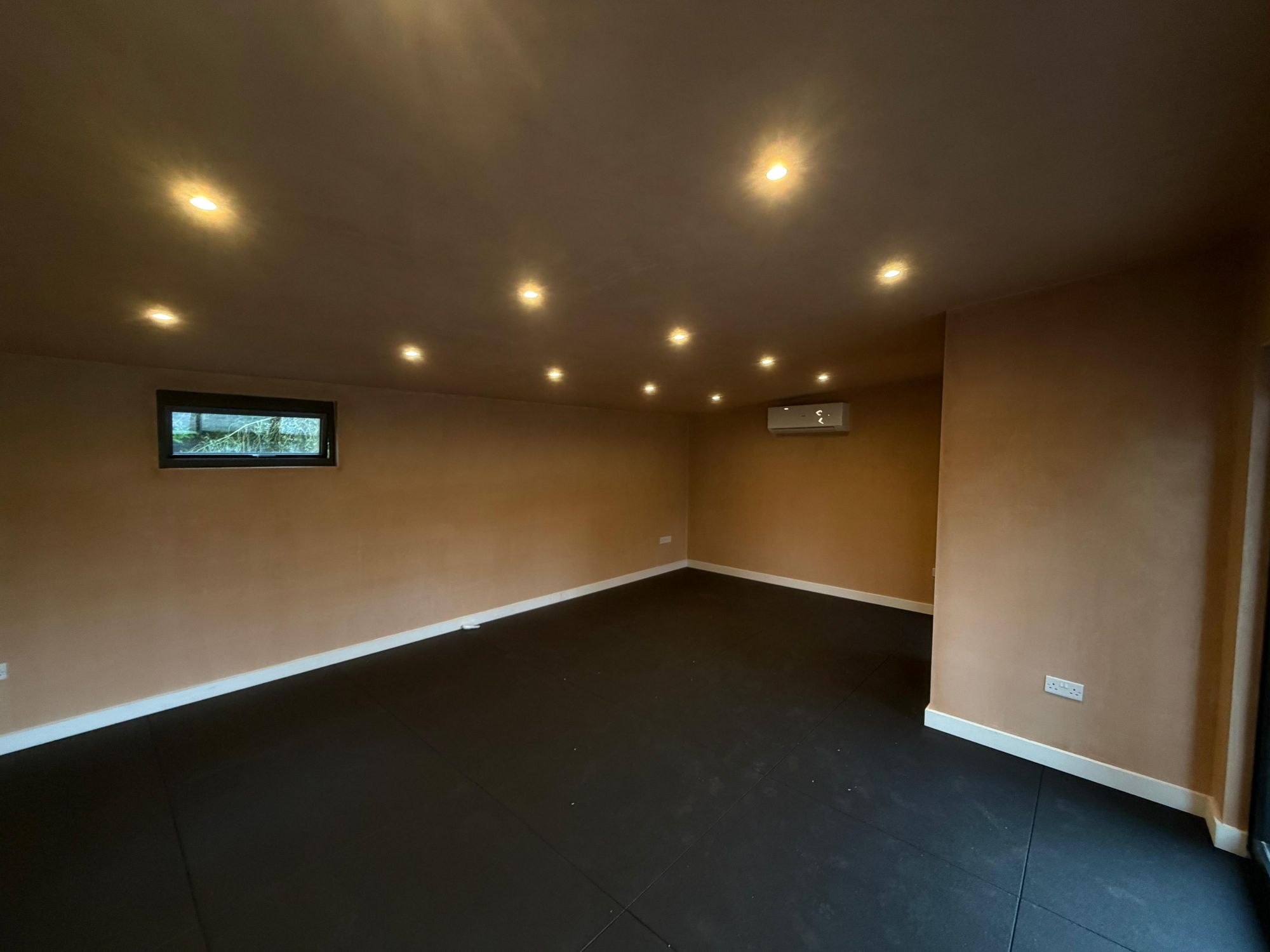 Rubber gym flooring in a garden room