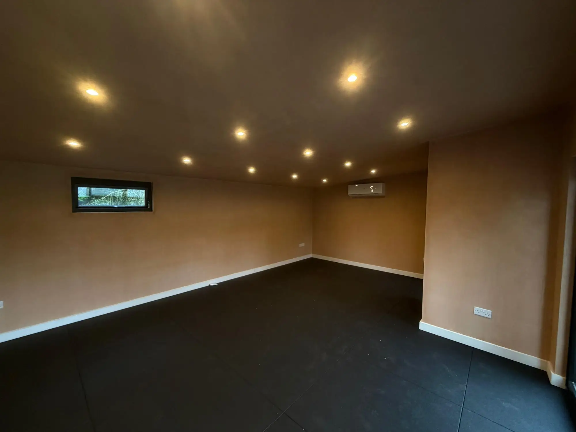 Rubber gym flooring in a garden room