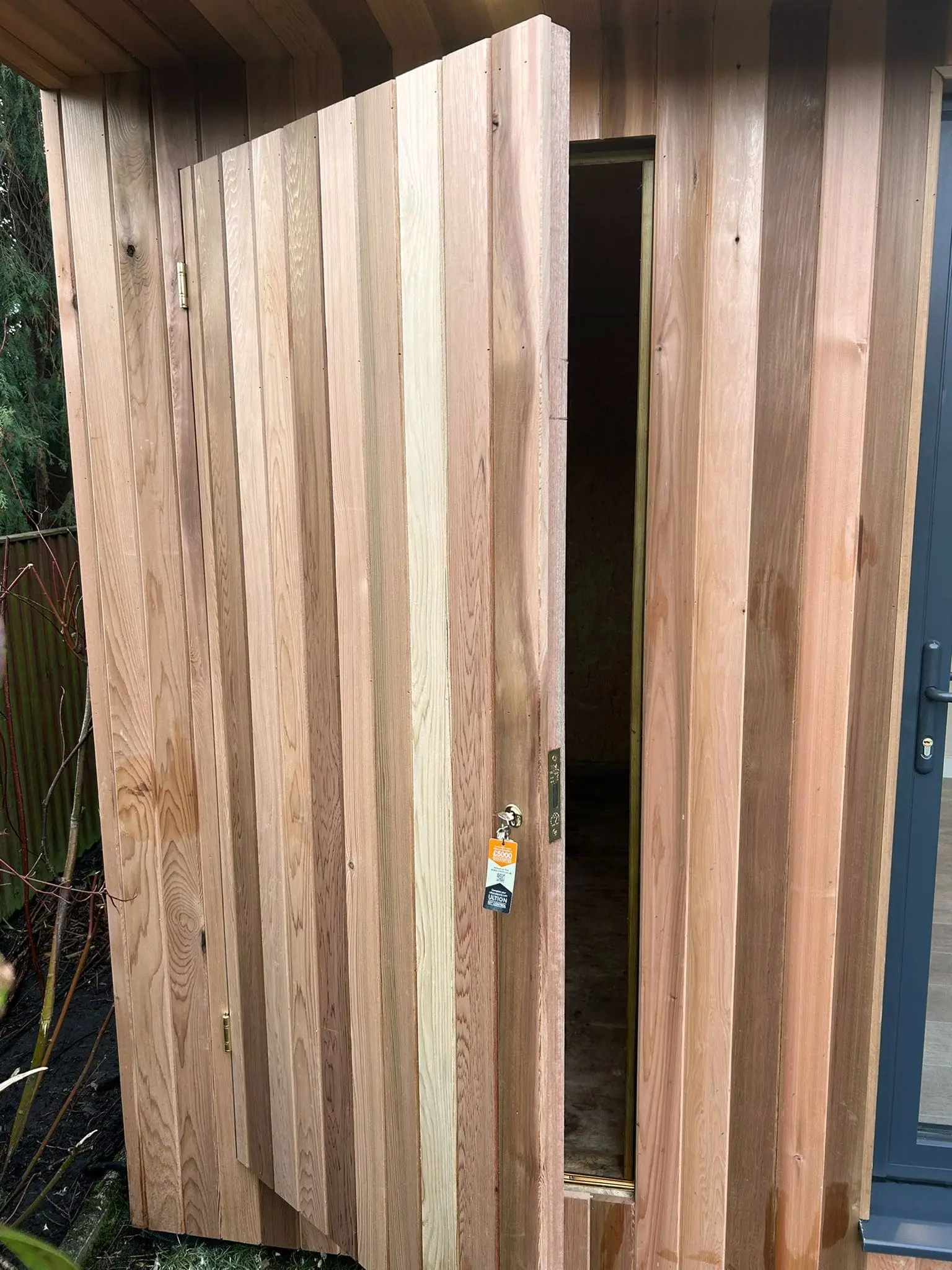 Hidden storage with cedar cladding