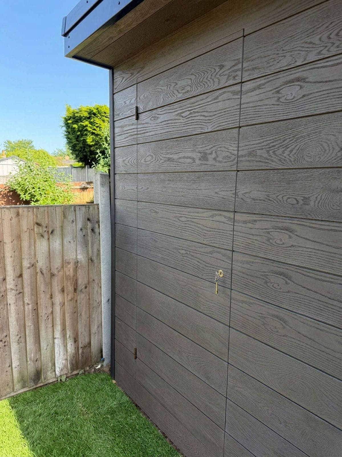 Secret storage door on a garden room by The Green Rooms, Surrey